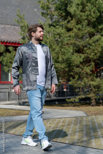 Caucasian man enjoying a stroll through Chinatown in traditional style