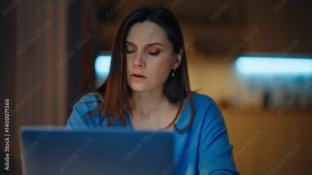 Overworked student reading papers at dark apartment closeup. Tired woman sleepy Overworked student reading papers at dark apartment closeup. Tired woman sleepy