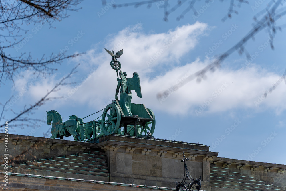 Fototapeta premium The chariot statue on top of the Brandenburg Gate. Close-up of the chariot statue.