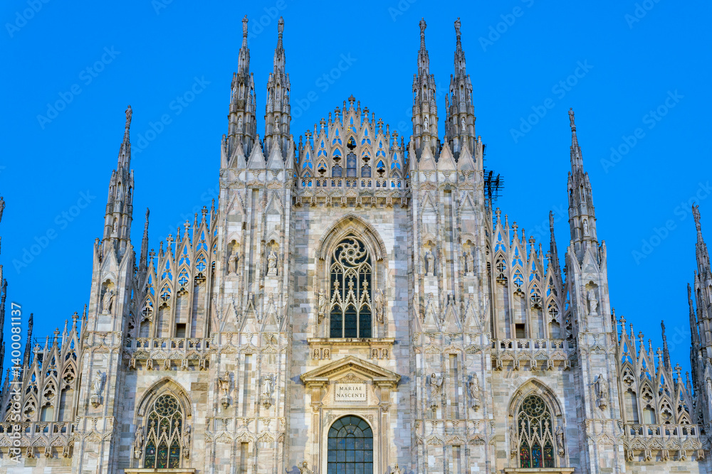 Fototapeta premium The facade of the Milan Cathedral at night