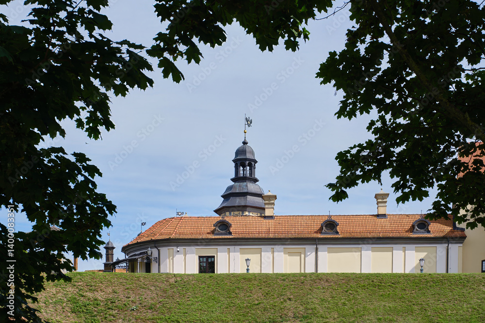 Fototapeta premium Nesvizh, Minsk region, Belarus - August 09, 2024: Nesvizh Castle, majestic historic castle in a summer day. Nesvizh Castle, Belarus. 