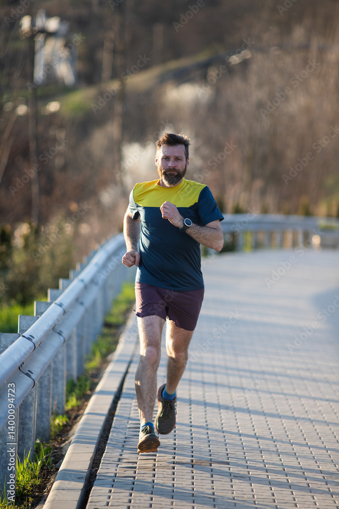 fit man in his forties running outdoors