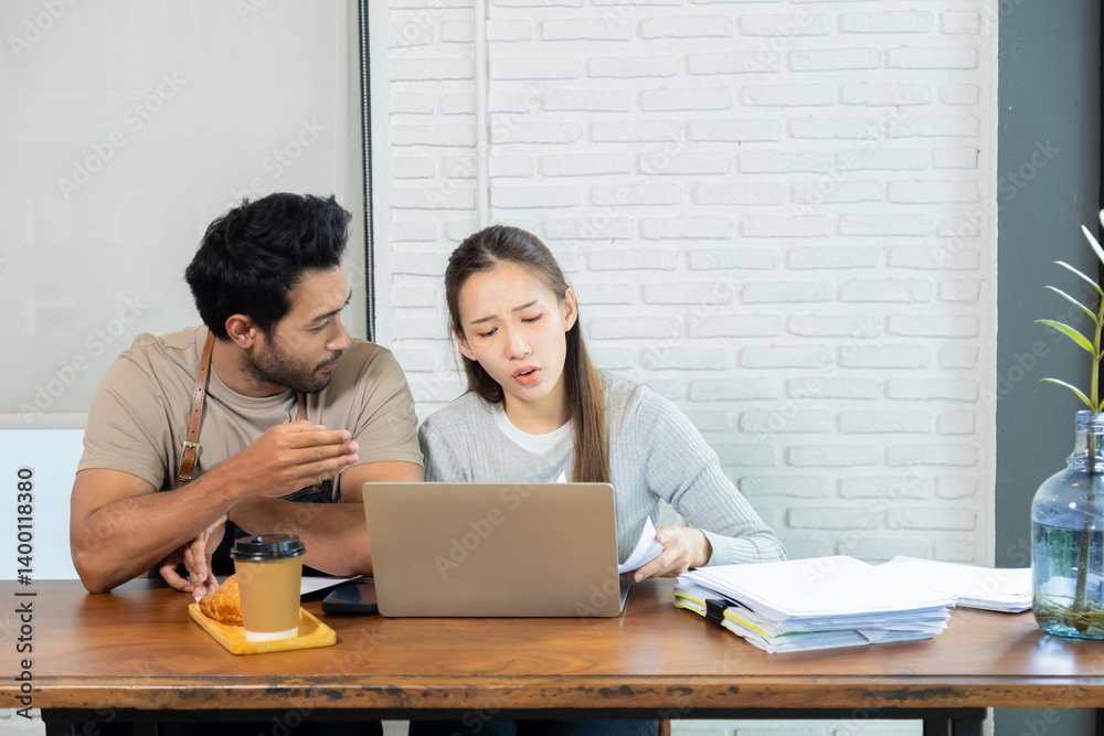 Lifestyle small business couple happy working together in cafe coffee shop, cheerful wife talking to husband or consulting project start-up planning, man and woman doing paperwork paying tax online