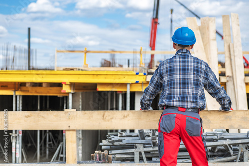 Construction Worker Overseeing Site Progress at Daylight