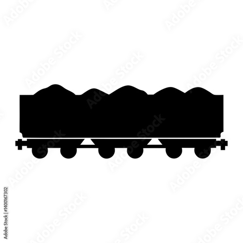 Silhouette image of a train car loaded with mounds of material