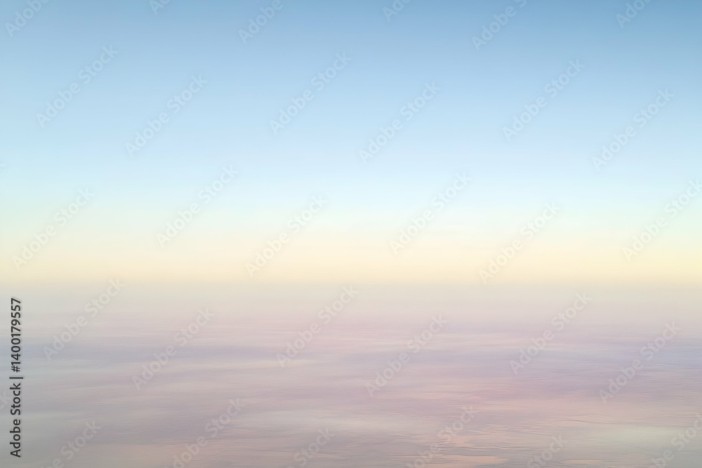 A serene view of pastel-colored clouds and sky from an aerial perspective. A serene view of pastel-colored clouds and sky from an aerial perspective.