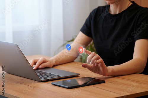 The choice is between accept or reject. Virtual interface, laptop, and female hands. the choice in favor of decline