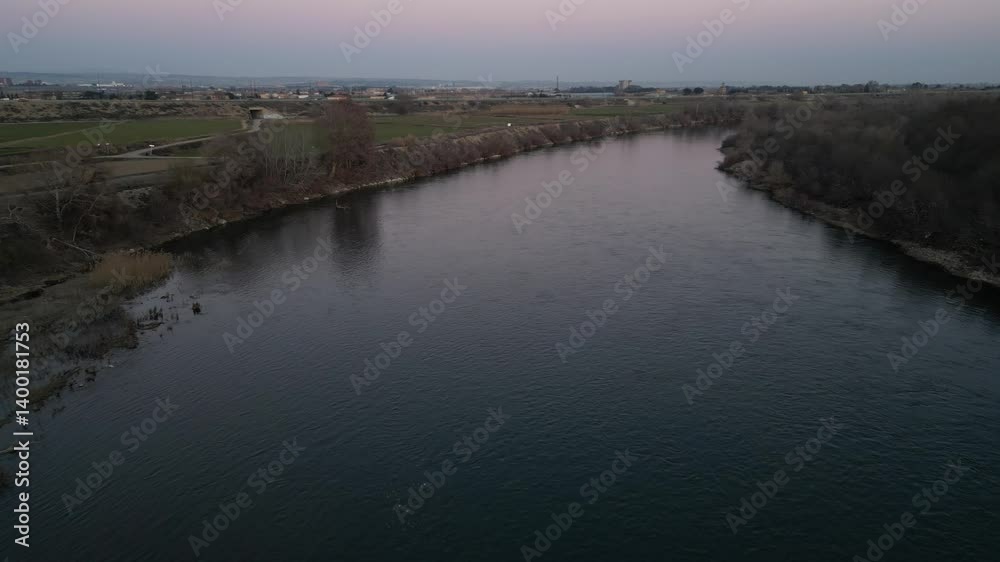 The Ebro River flowing through the countryside. Aerial drone shot. In Zaragoza, Spain The Ebro River flowing through the countryside. Aerial drone shot. In Zaragoza, Spain