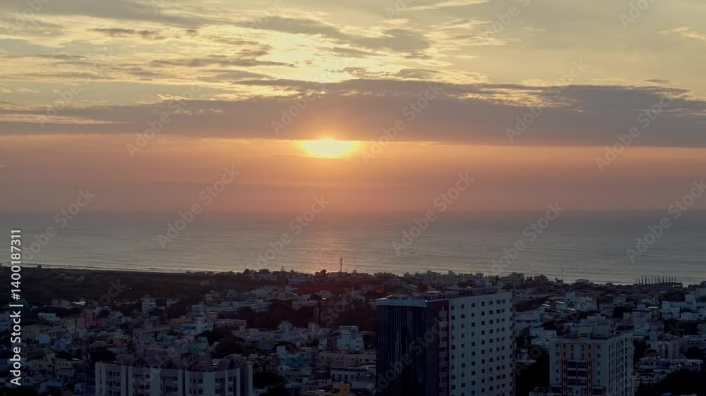 Aerial shot capturing sunn getting covered by thick clouds at horizon with cityscape in foreground. Aerial shot capturing sunn getting covered by thick clouds at horizon with cityscape in foreground.
