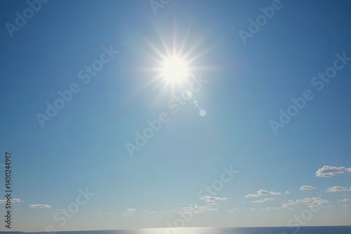 Clear sky, bright sun, ocean horizon