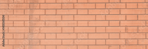 Obraz na płótnie Red brick wall texture. The decorative plaster imitating a bricklaying and the socle revetted with a stone. Background brickwork. w salonie