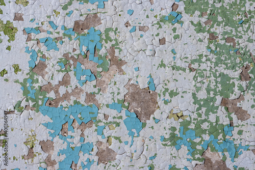 Obraz na płótnie Peeling paint on the wall. Old concrete wall with cracked flaking paint. Weathered rough painted surface with patterns of cracks and peeling. Grunge texture for background and design. High resolution. w salonie