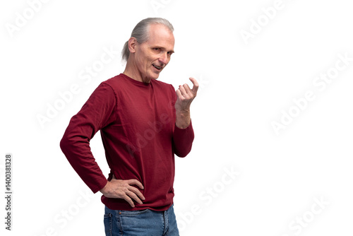 Cunning senior man gesturing come here with sly expression on white background