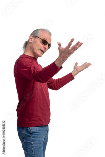 Older man in red shirt gesturing expressively