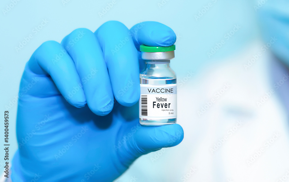 Doctor wearing protective gloves holding a Yellow Fever vaccine bottle, symbolizing modern healthcare, disease prevention, scientific research, immunization, vaccination awareness. Banner, copy space