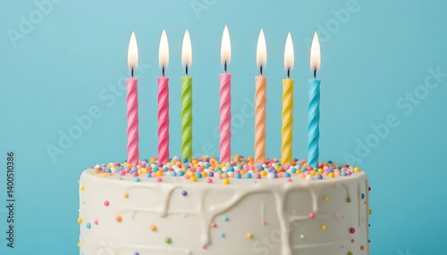 A celebratory birthday cake with seven brightly colored, spiraled candles burning against a pastel blue background, a joyful symbol of sweet wishes and happy memories.