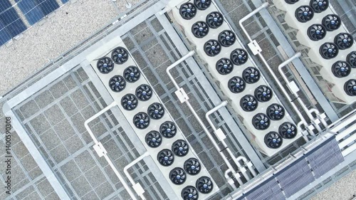 Aerial view of ventilators and HVAC systems on data center rooftop, cooling infrastructure for server operations