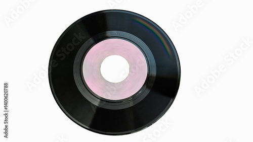 Obraz na płótnie Close up of a vintage vinyl record with a pink label, isolated on a white background, representing nostalgia and musical history w salonie