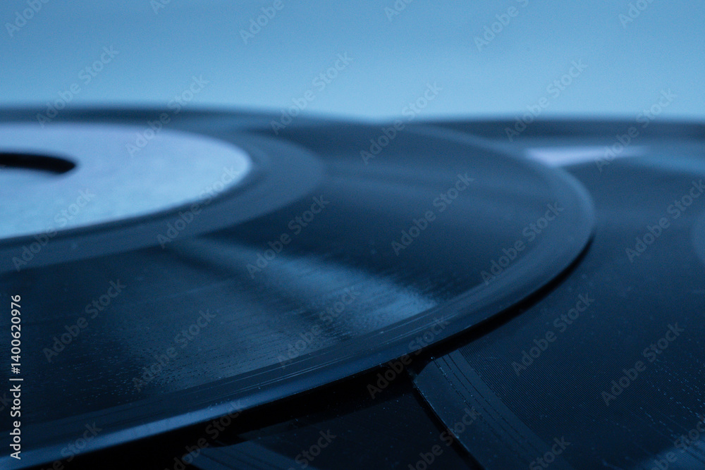 Close up of vintage vinyl records, highlighting the grooves and label, evoking nostalgia for classic music