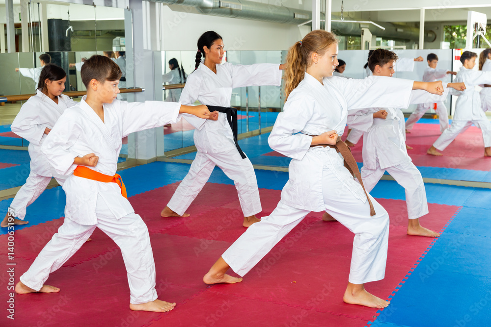 Young teenagers happy to attend karate class on self-defense Young teenagers happy to attend karate class on self-defense