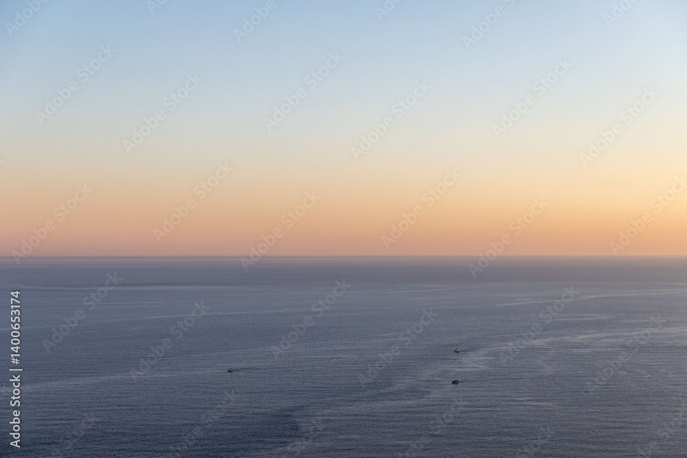 Peaceful view of the sea under a vivid sunrise sky