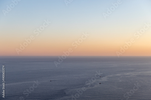 Peaceful view of the sea under a vivid sunrise sky