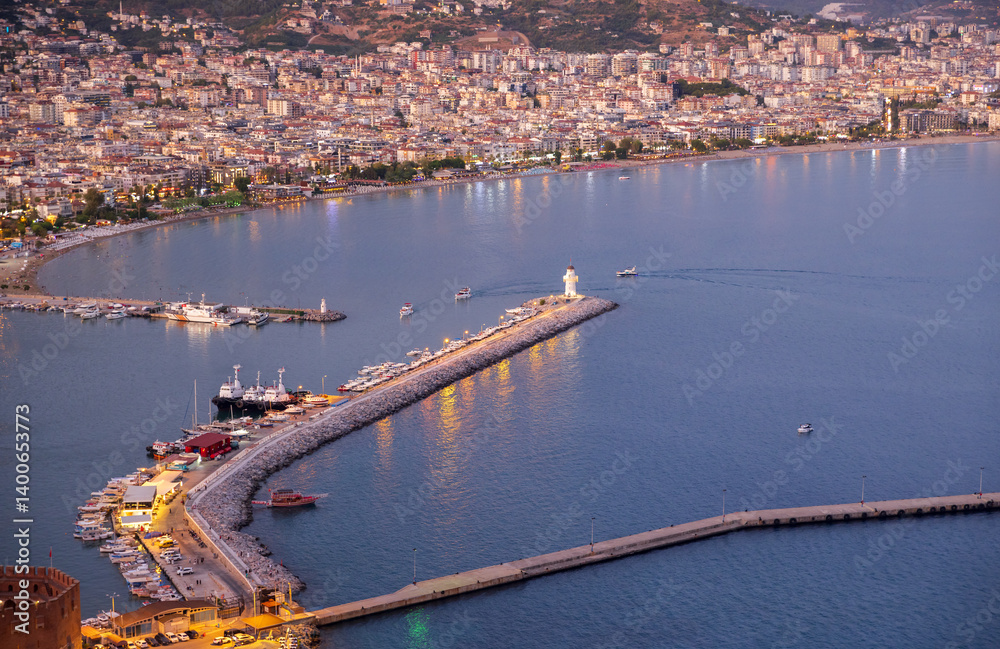 Alanya, Turkey. Evening aerial harbor view with cityscape and lighthouse