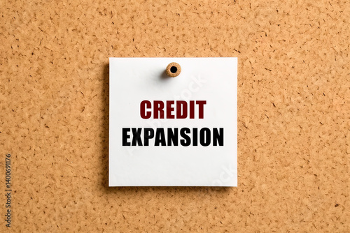 Credit expansion text on post-it paper pinned on the bulletin cork board