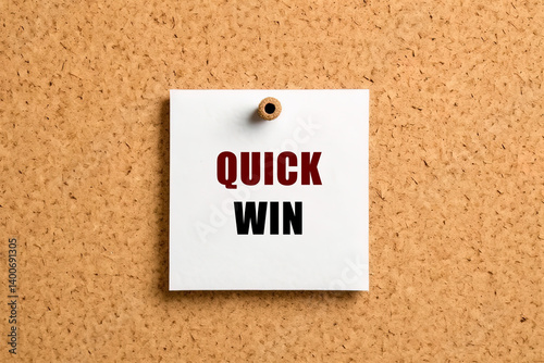 Quick win text on post-it paper pinned on the bulletin cork board