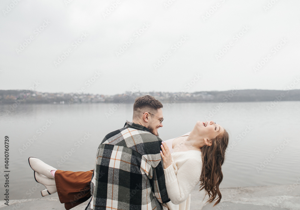 Fototapeta premium Smile with braces. Beautiful girl with braces on a date. Young people dancing, kissing and hugging, enjoying the meeting