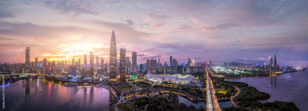 Naklejka premium Captivating Shenzhen Skyline at Sunset with Reflections and City Lights