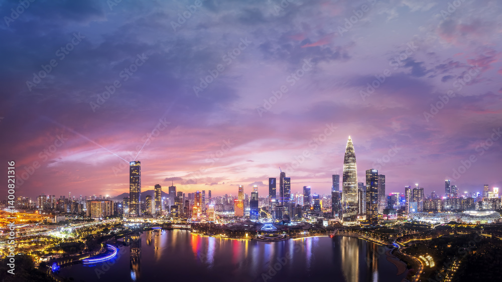 Fototapeta premium Stunning Cityscape Panorama at Sunset with Vibrant Colors and Reflections
