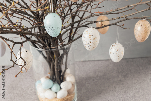 Obraz na płótnie Easter tree decorated colorful pastel white and beige eggs. Birch branches with hang eggs in vase. Happy Easter greeting card. Close up w salonie