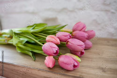 a bunch of Tulips on a shelf. Festive bouquets for women on March 8, bulbous spring flowers