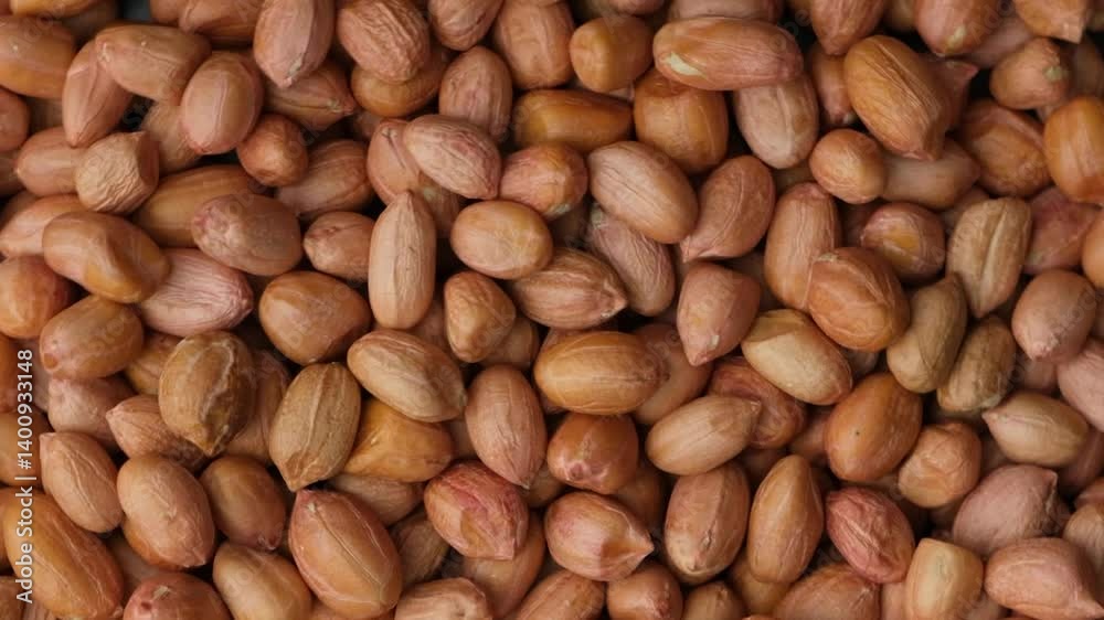 Raw brown peanuts close-up top view rotate Raw brown peanuts close-up top view rotate
