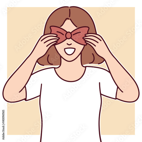 Smiling woman covering her eyes with hands and red bow, expressing playful surprise or joyful gesture in casual pastel setting