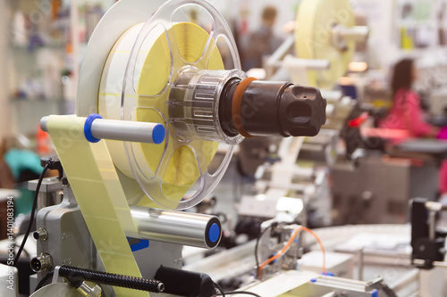 Tableau sur toile Labeling installation, automatic label applicator in production