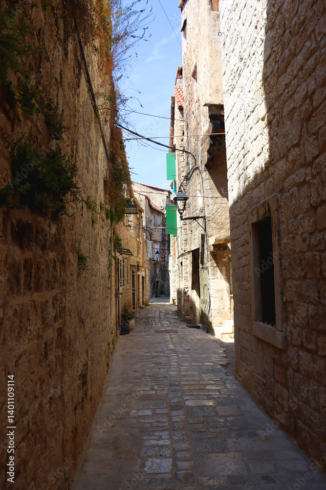 Picturesque Mediterranean street and traditional architectural details in Trogir, Croatia.