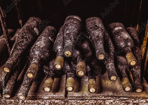 Stack of wine bottles in cellar