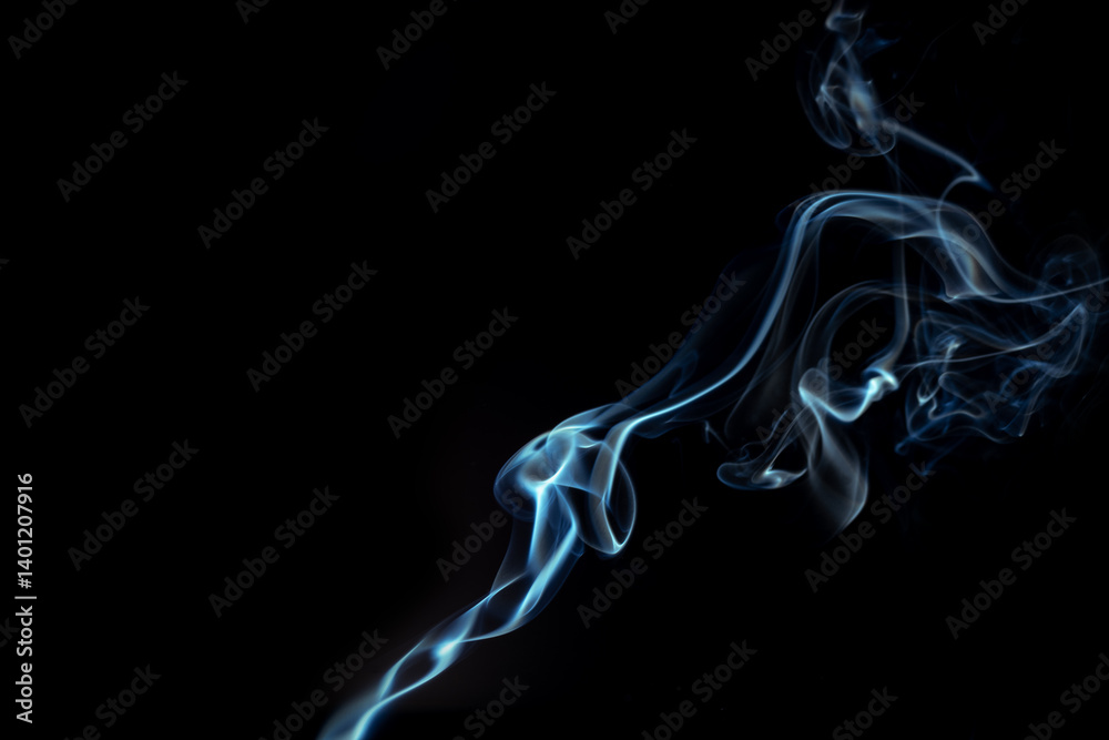 Blue smoke swirls in abstract form, photography style on black background. Concept of mystery and creativity. Swirling, writhing smoke to overlay on your photos Blue smoke swirls in abstract form, photography style on black background. Concept of mystery and creativity. Swirling, writhing smoke to overlay on your photos