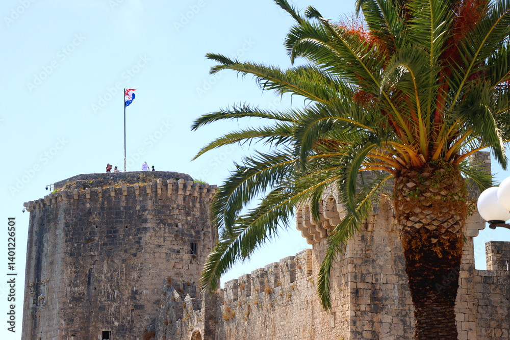 Historical Kamerlengo Fortress in Trogir, Croatia and Croatian flag.