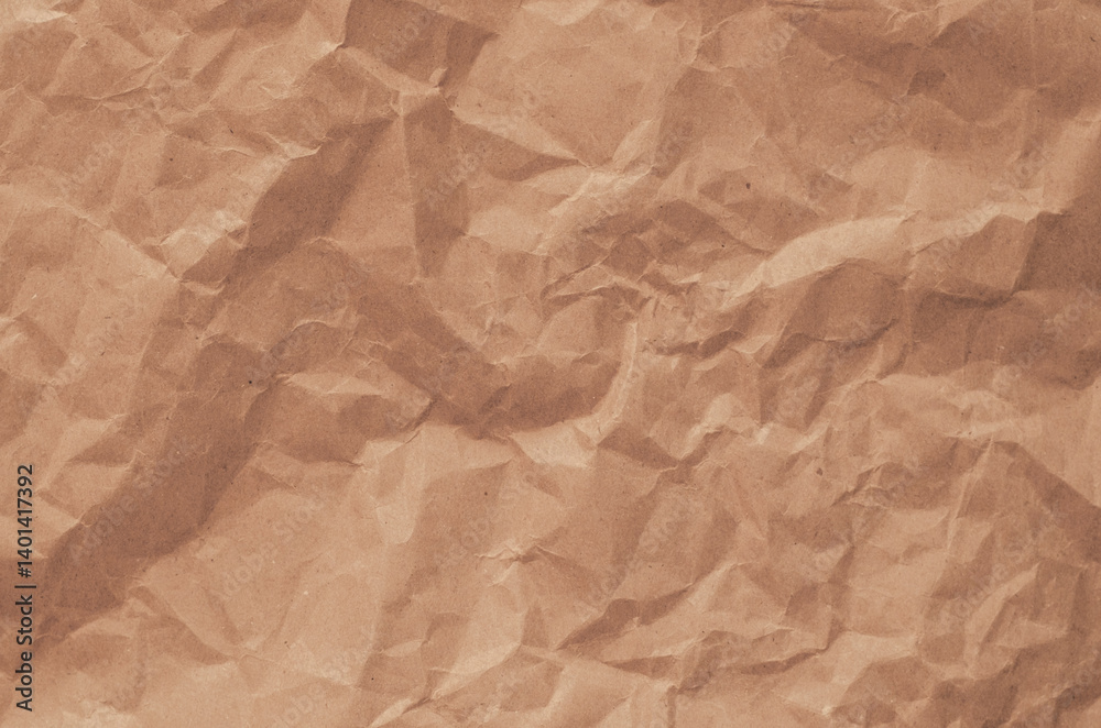 Obraz premium A brown paper with a crumpled texture