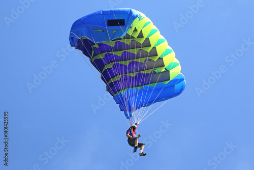 Skydiver in a blue sky	