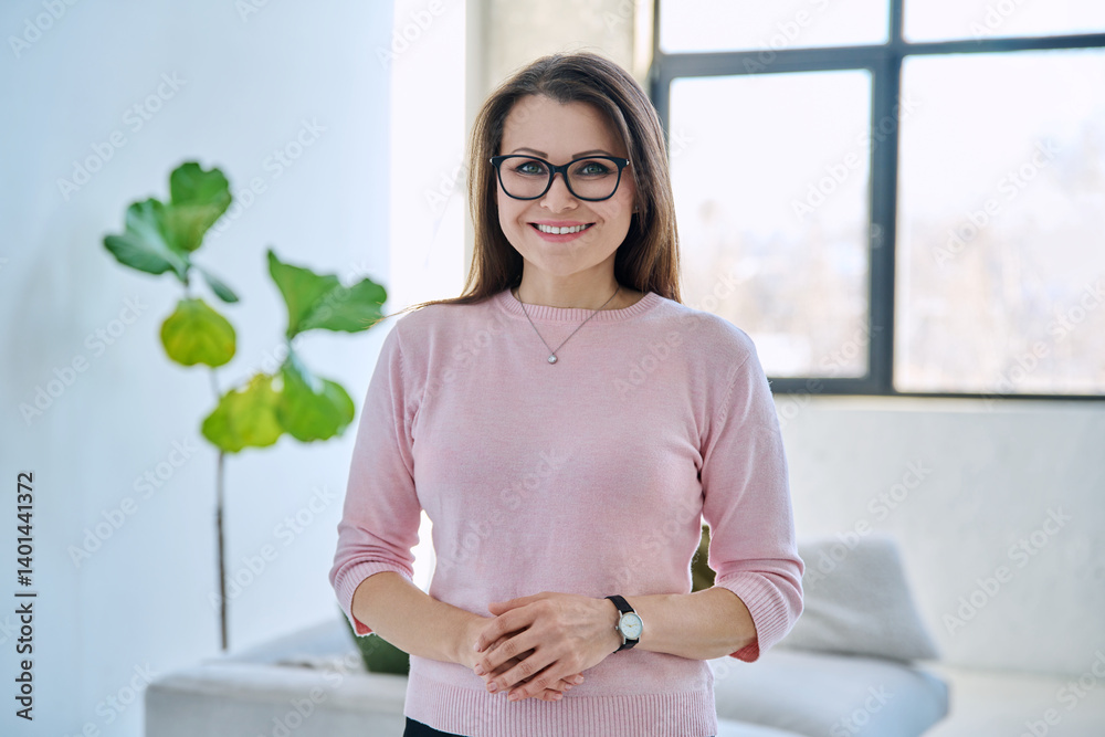 Confident successful mature beautiful woman looking at camera