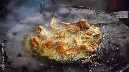 Hilsha fish is fried in a big pan along with shrimp and eggplant, Hilsha Fish and shrimp Simmering in mustard oil, traditional Bengali style fried hilsa and eggplant	