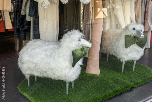 Decorative figures of sheep in the window of a clothing store