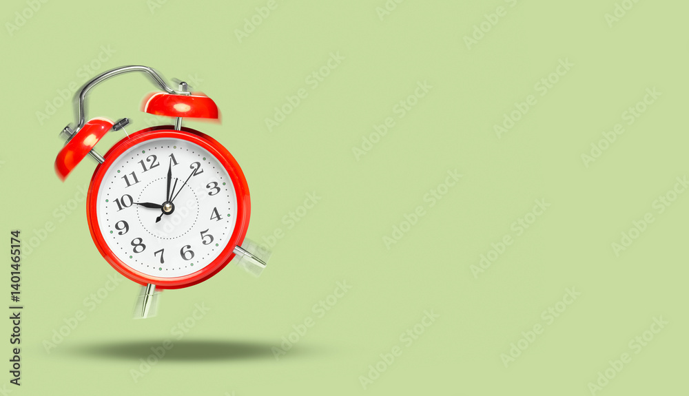 Red alarm clock ringing and jumping on sage color background. Banner design with space for text