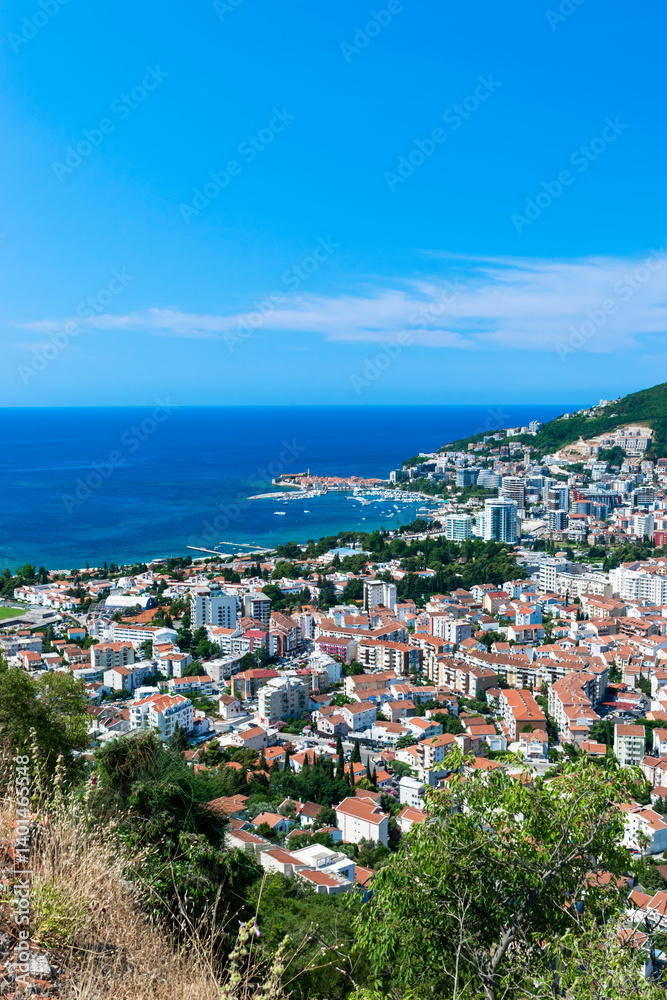 Panoramic landscape of resort Budva city on blue sky background. Top view. The architecture of the old and new city, located on Adriatic coast. Montenegro. Panoramic landscape of resort Budva city on blue sky background. Top view. The architecture of the old and new city, located on Adriatic coast. Montenegro.