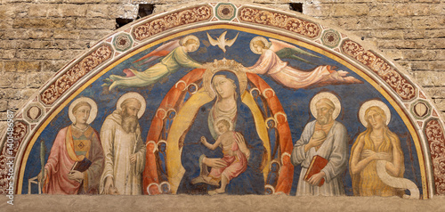 FLORENCE, ITALY - MARCH 19, 2025: The mnedieval fresco of Madonna (queen) among the sanits in the church Basilica San Miniato al Monte Maestro della Sant'Agata (cca 1260).