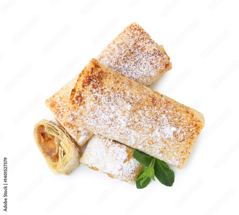 Tasty apple strudels with powdered sugar and mint isolated on white, top view
